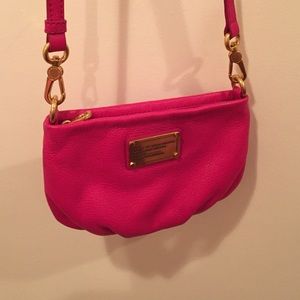 Hot pink crossbody bag.