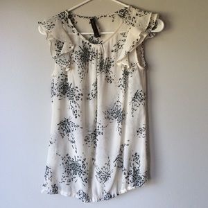 The limited sheer top with frilly cap sleeves