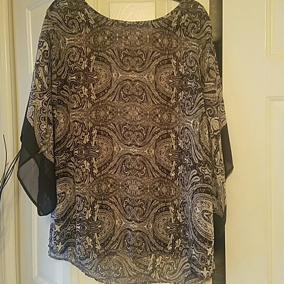 Sheer blouse/poncho style.