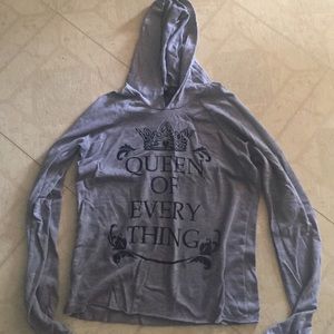 A long sleeve shirt with hoodie. Worn once