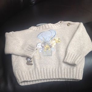 Size 3/ 6 mos sweater. Never worn great condition