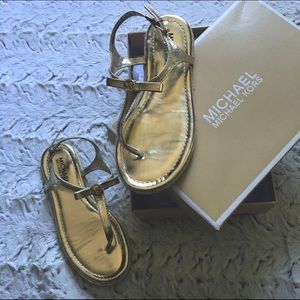 Michael Kors gold sandal.
