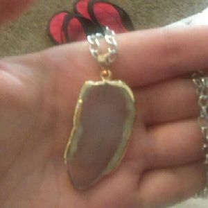 White stone with gold trim around it