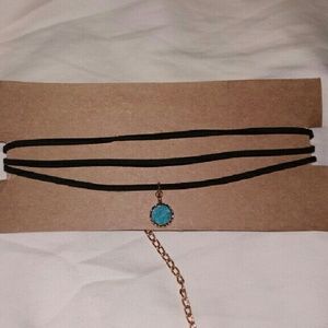 Black suede choker necklace with blue stone