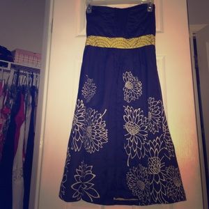 Grey dress with floral print and yellow belt