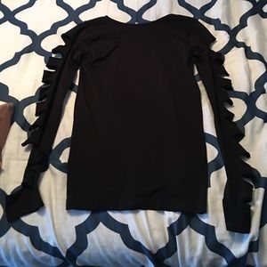 Black long sleeve with slits.