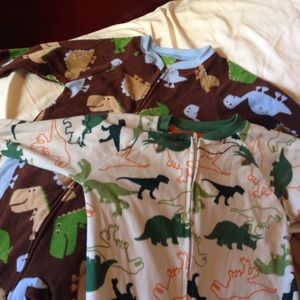 2 Carter Pjs. Gently used. Cute dinosaur print.