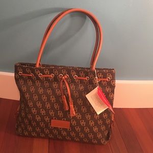 Never used tag still on Dooney and Bourke bag.