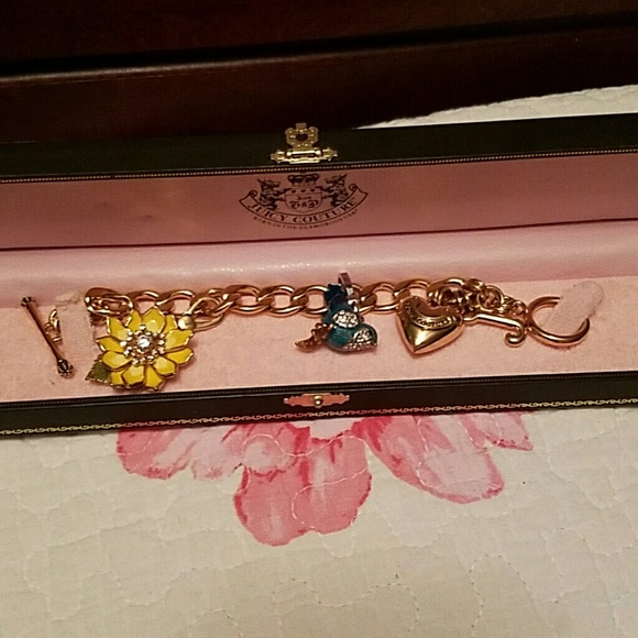 Gold Juicy Couture charm bracelet with charms