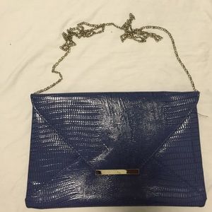 Blue faux leather clutch w/detachable chain strap.