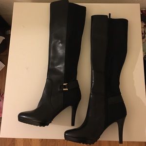 Black heeled knee high boots