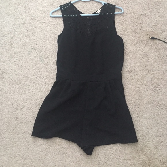 Black romper with high lace neckline