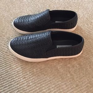 Black leather Steve Madden perforated slip ons
