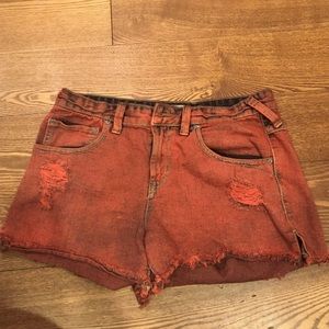 Red faded Free People distressed jean shorts