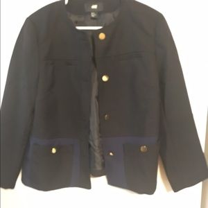 Blazer with navy pockets and gold button details.