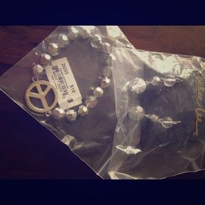 Peace sign bracelet and ball dangle earrings