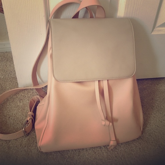A pink vegan friendly leather back pack.