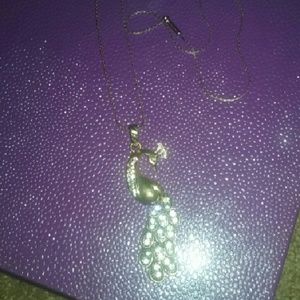 Gold and white diamond peacock necklace