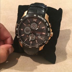 Gold and black leather band Tayroc watch