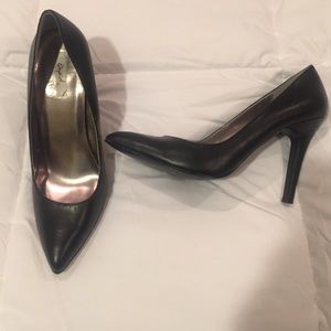 Black leather pumps