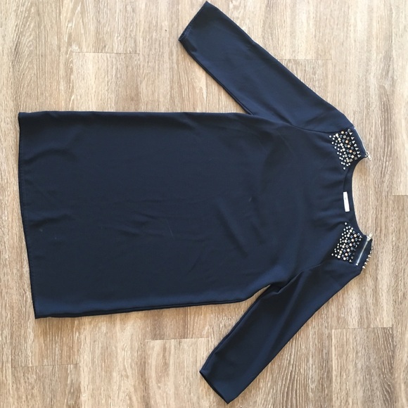 Navy dress with shoulder embellishment