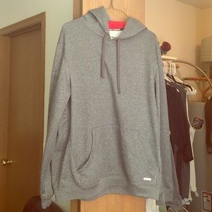 Brand new gray sweatshirt with red lining.