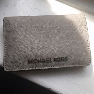 Gently used Silver Michael Kors Bi-Fold Wallet!
