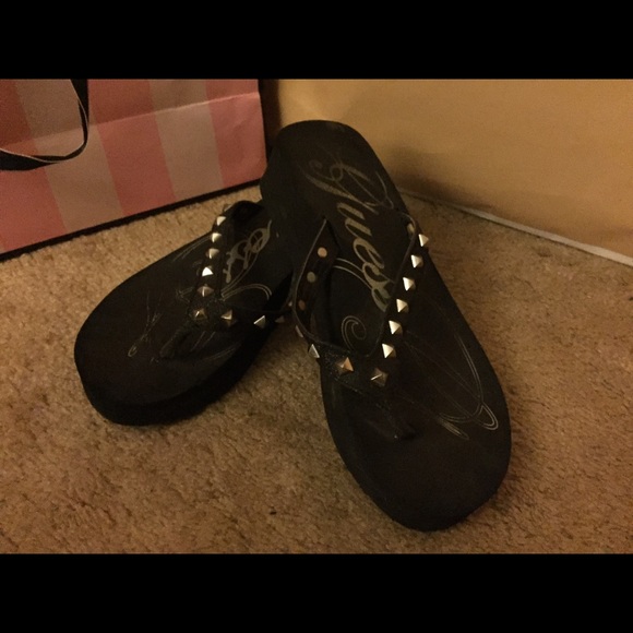 Black studded Guess flip-flops