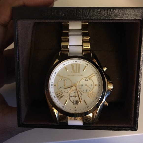 White and gold Michael Kors watch.