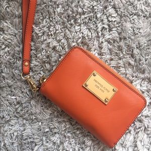 Michaels Kors orange leather wristlet!