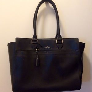 Cole Haan black tote with pink interior lining.
