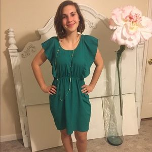 Bold green knee length dress