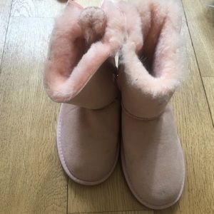Pink Uggs with lace-up