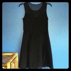 Black cocktail dress with sheer mesh top