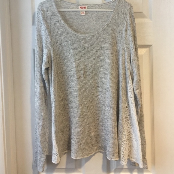 Cute sweater with lace detailing on the sides!