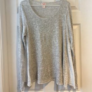 Cute sweater with lace detailing on the sides!