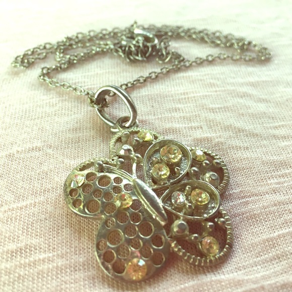 Butterfly inside flower necklace