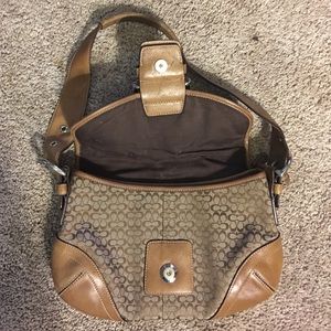 Used coach a ink spot on inside buckle