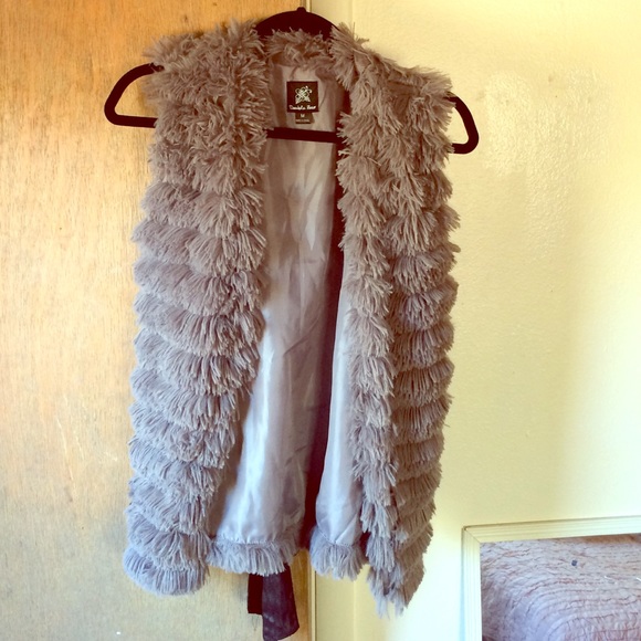 A faux fur vest from buckle. Never been worn!