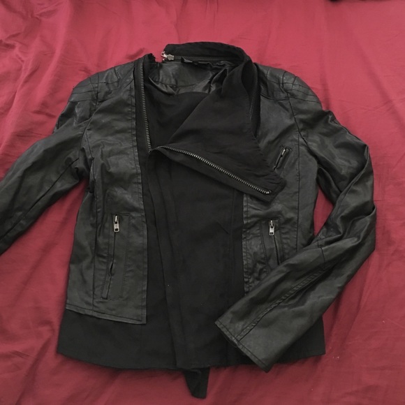 Leather jacket with zipper and paneling details