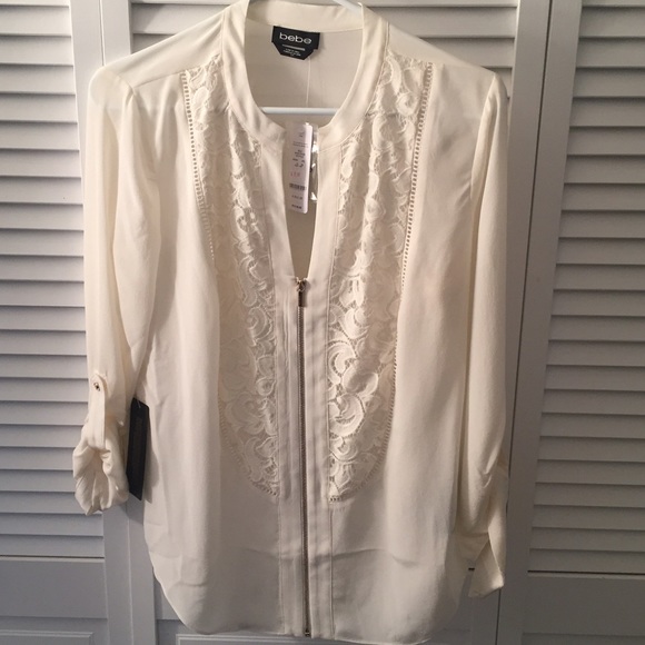 NWT Bebe blouse with lace detailing.