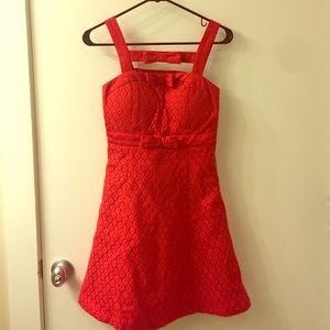 Red girly above the knee dress.
