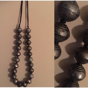 Giant silver beaded necklace
