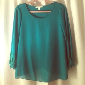 Green blouse with slit in back!