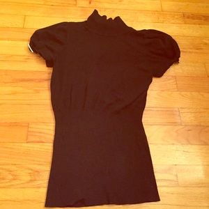 Black mock neck short sleeve sweater.