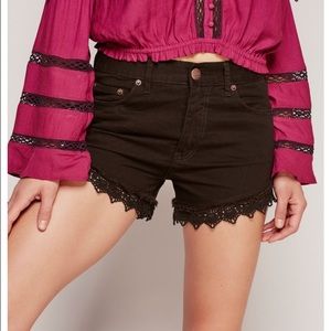 Free People black denim lace cutoff shorts