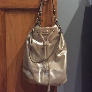 Gold Shimmery Coach Pocket Book