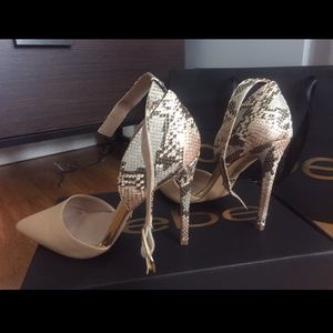 bebe high heels with a hint of snakeskin.