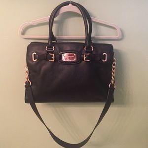 Black leather with rose gold metal detail
