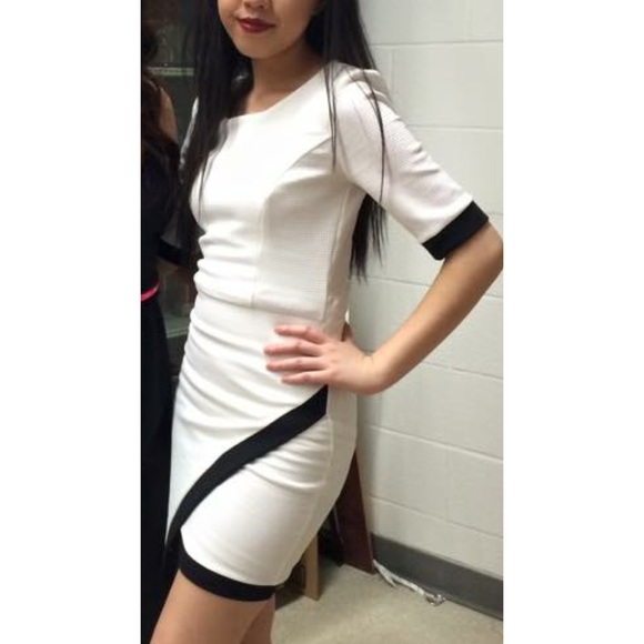 White dress with black trim asymmetrical dress.